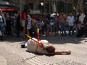 09.06.2006. El grupo ecologista AnimaNaturalis escenificó ayer en plena Canaletes la ejecución de un humano a banderillazos tal y como lo sufren los toros. Su objetivo es concienciar a los turistas para que no acudan a las corridas durante su estancia.